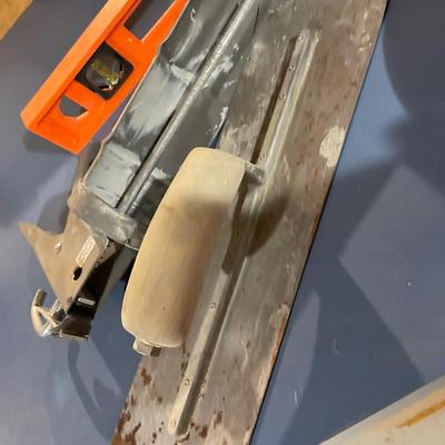 Lot 367 bucket of concrete tools, caulk gun, level, 2 backer rods