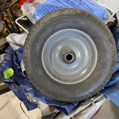 Lot 377 wheelbarrow and tarps (extra wheel for wheel barrow)