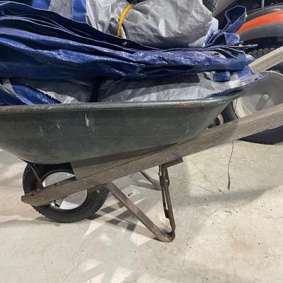 Lot 377 wheelbarrow and tarps (extra wheel for wheel barrow)