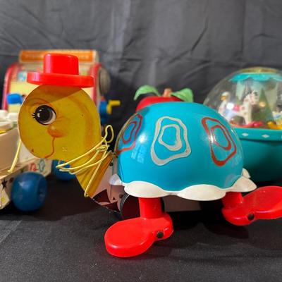 Lot of Vintage Fisher Price Toys including Roller Skates!