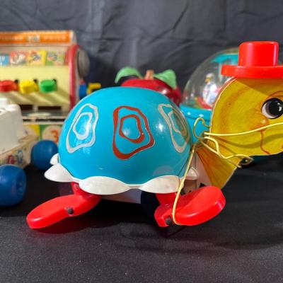 Lot of Vintage Fisher Price Toys including Roller Skates!