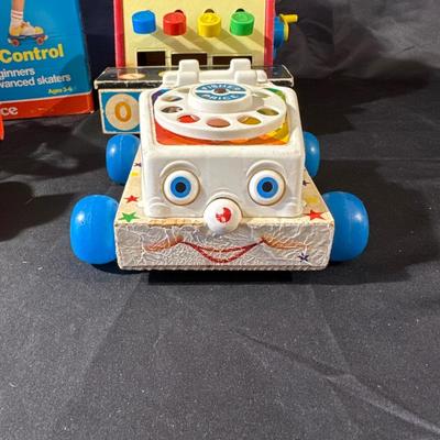 Lot of Vintage Fisher Price Toys including Roller Skates!