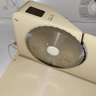 Finger shortening device/vintage meat slicer