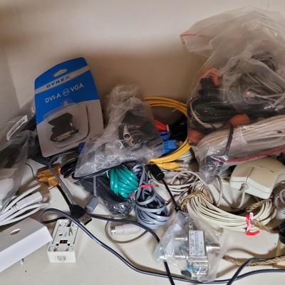 Lots and lots of cords and a zip reader and a floppy reader and a disk drive