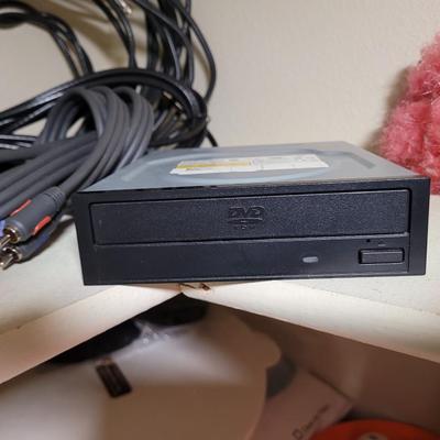 Lots and lots of cords and a zip reader and a floppy reader and a disk drive