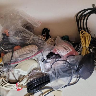 Lots and lots of cords and a zip reader and a floppy reader and a disk drive