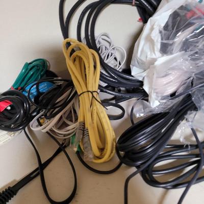 Lots and lots of cords and a zip reader and a floppy reader and a disk drive