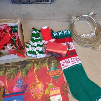 CHRISTMAS DECOR, STOCKINGS, RED LIGHT BULBS, RUG, ROPE LIGHT AND BOWS