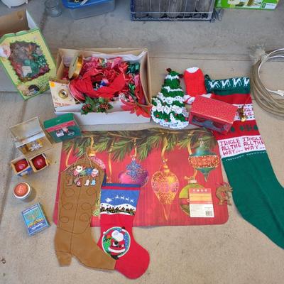 CHRISTMAS DECOR, STOCKINGS, RED LIGHT BULBS, RUG, ROPE LIGHT AND BOWS