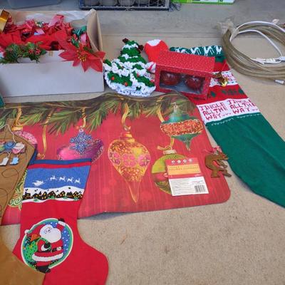 CHRISTMAS DECOR, STOCKINGS, RED LIGHT BULBS, RUG, ROPE LIGHT AND BOWS