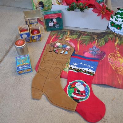 CHRISTMAS DECOR, STOCKINGS, RED LIGHT BULBS, RUG, ROPE LIGHT AND BOWS