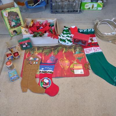 CHRISTMAS DECOR, STOCKINGS, RED LIGHT BULBS, RUG, ROPE LIGHT AND BOWS
