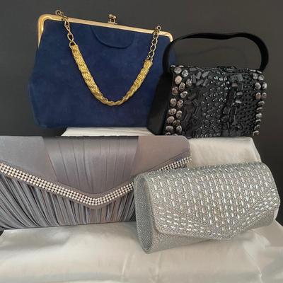 LOT 7: Evening Purses Galore Featuring a Gorgeous Vintage Blue Suede Evening Purse With Braided Gold tone Chain, Pair of Silvertone...