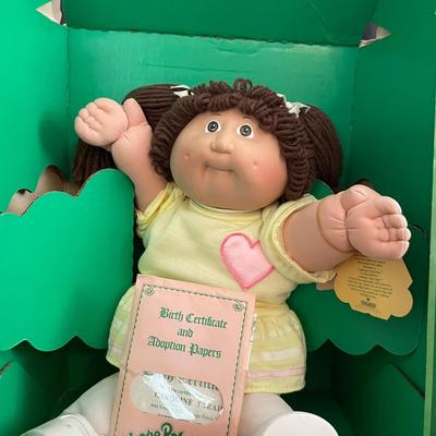 LOT 11: Adorable Cabbage Patch Doll with Adoption Papers and Baby Sinclair Talking Dinosaur (see pictures)
