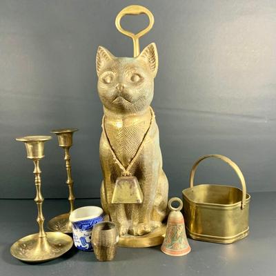LOT32: Big Brass Collection Featuring a Brass Cat Door Stop, Candle Stick Solders, Bells. Basket and More