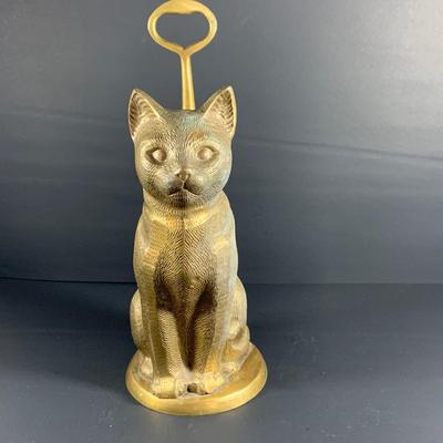 LOT32: Big Brass Collection Featuring a Brass Cat Door Stop, Candle Stick Solders, Bells. Basket and More