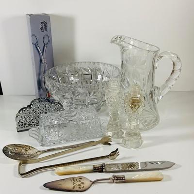 LOT 43: Collection of Crystal and Other Serving Essentials, Including a Crystal Pitcher, Salt and Pepper Shakes, Covered Butter Dish,...