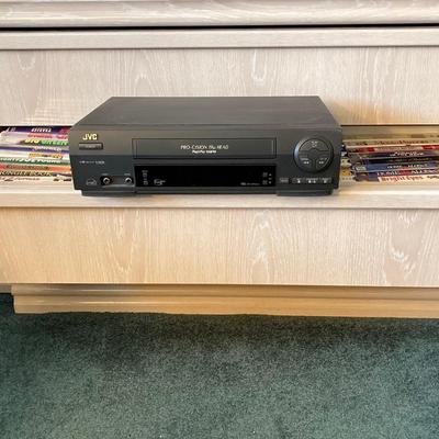 LOT 77: JVC VHS Video Cassette Recorder Player Model No HR-VP48U and Collection of Tapes and CDs