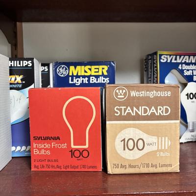 LOT 82: Laundry Room Shelf Lot: Scissors, Light Bulbs, Flashlights, Angels & More