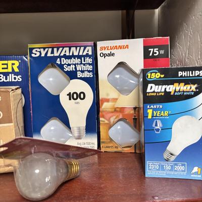 LOT 82: Laundry Room Shelf Lot: Scissors, Light Bulbs, Flashlights, Angels & More