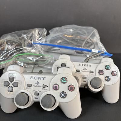 LOT 90: Sony PlayStation SCPH-7001 w/2 Controllers, Memory Card & Cords/Adaptors
