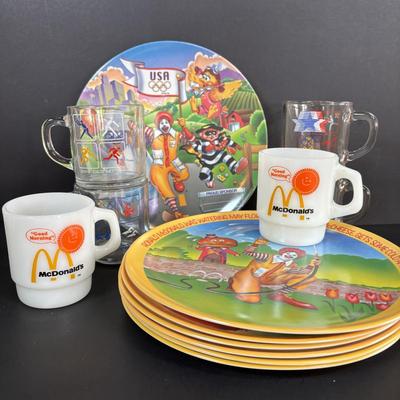 LOT 92: McDonalds Anchor Hocking Fire King Mugs, 1984 Olympic Glass Mugs, 1996 Atlanta Olympic Plates & the Four Seasons Plates