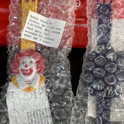 LOT 99: Vintage 1970s Ronald McDonald Plastic Bank, Ceramic Grimace Bank, Digital Watches, Character Pencils in Holder, 2004 Ty McDonalds...
