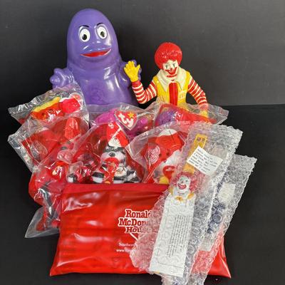 LOT 99: Vintage 1970s Ronald McDonald Plastic Bank, Ceramic Grimace Bank, Digital Watches, Character Pencils in Holder, 2004 Ty McDonalds...