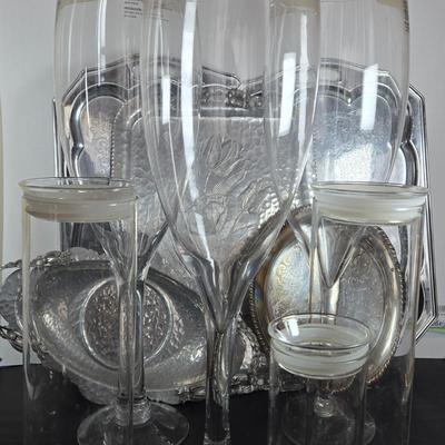 LOT 111: Oversized Centerpiece Champagne Glasses, Silver Trays, Zens Glass Canister Set, Hand Wrought Creations by Rodney Kent Trays...