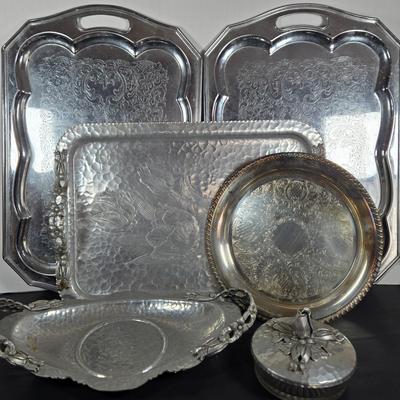 LOT 111: Oversized Centerpiece Champagne Glasses, Silver Trays, Zens Glass Canister Set, Hand Wrought Creations by Rodney Kent Trays...