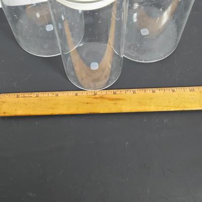 LOT 111: Oversized Centerpiece Champagne Glasses, Silver Trays, Zens Glass Canister Set, Hand Wrought Creations by Rodney Kent Trays...