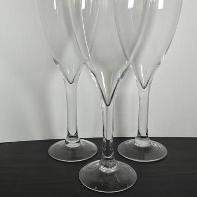 LOT 111: Oversized Centerpiece Champagne Glasses, Silver Trays, Zens Glass Canister Set, Hand Wrought Creations by Rodney Kent Trays...