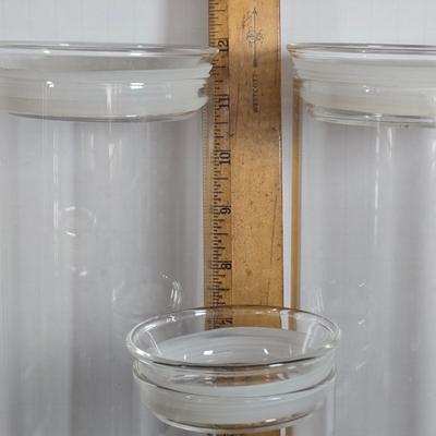 LOT 111: Oversized Centerpiece Champagne Glasses, Silver Trays, Zens Glass Canister Set, Hand Wrought Creations by Rodney Kent Trays...