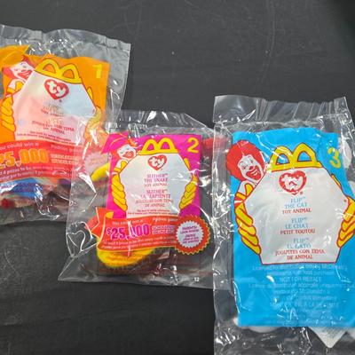 LOT 117: Complete Set of YEAR 2000 TY BEANIES and Incomplete Set of SPY KIDS 2 McDonalds Happy Meal Toys; All in Unopened, Original Packing