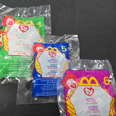 LOT 122: All in Unopened Original Packing; Complete Set of YEAR 2000 TY BEANIES, Complete Set of LILO and STITCH Happy Meal Toys