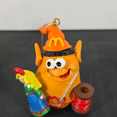 LOT 129: "SANTA'S MERRY MCNUGGETS ORNAMENTS" ,TINY TIM & Small Dept. 56 Ornaments, and Dept. 56 1999 "THE FIRST...