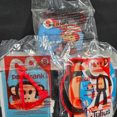 LOT 135: Complete Set of PAUL FRANK Happy Meal Toys, Toy Truck ; Please Note Missing Wheel, Incomplete Set of RONALD and FRIENDS, Large...