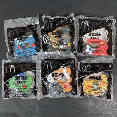 LOT 194: McDonalds NIP Happy Meal Toys: Ty Teenie Beanies Complete Set 1-18, Sega Sonic 1-6 Complete, Space Jam Nerdlucks