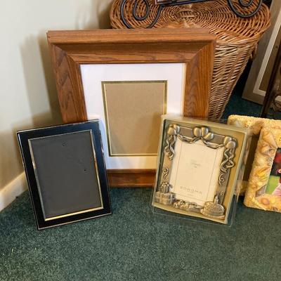 LOT 202: Large Home Decor Collection - Wicker Basket, Frames, Easel, Prints, Candles, Candle Holders and More