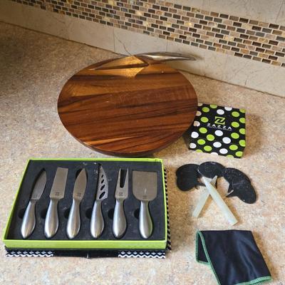 LOT 30K: Nambre Cheese Cutting Board With Knife, Zazza Knife and Serving Set, and Zazza 5 Piece Slate Cheese Marker Set