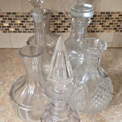 LOT 32K: Multiple Wine Decanters in Various Shapes and Sizes