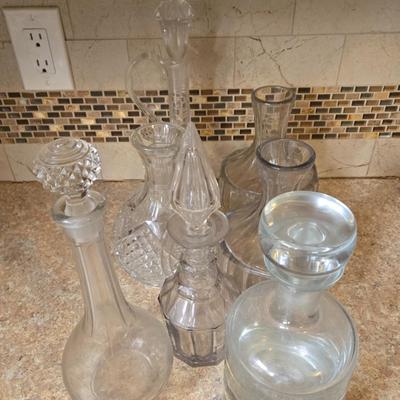 LOT 32K: Multiple Wine Decanters in Various Shapes and Sizes
