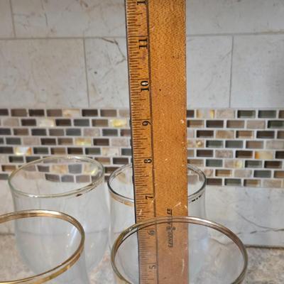 LOT 34K: Set of 12 Pasabahce Circle Art of Glass Gold Rim Glasses, Set of 7 Fostoria Classic Gold Water Goblets, and Set of 4 Artland...