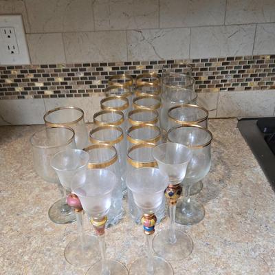 LOT 34K: Set of 12 Pasabahce Circle Art of Glass Gold Rim Glasses, Set of 7 Fostoria Classic Gold Water Goblets, and Set of 4 Artland...