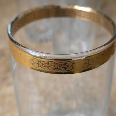 LOT 34K: Set of 12 Pasabahce Circle Art of Glass Gold Rim Glasses, Set of 7 Fostoria Classic Gold Water Goblets, and Set of 4 Artland...