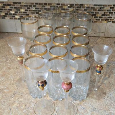 LOT 34K: Set of 12 Pasabahce Circle Art of Glass Gold Rim Glasses, Set of 7 Fostoria Classic Gold Water Goblets, and Set of 4 Artland...