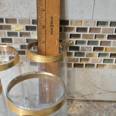 LOT 34K: Set of 12 Pasabahce Circle Art of Glass Gold Rim Glasses, Set of 7 Fostoria Classic Gold Water Goblets, and Set of 4 Artland...