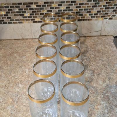 LOT 34K: Set of 12 Pasabahce Circle Art of Glass Gold Rim Glasses, Set of 7 Fostoria Classic Gold Water Goblets, and Set of 4 Artland...