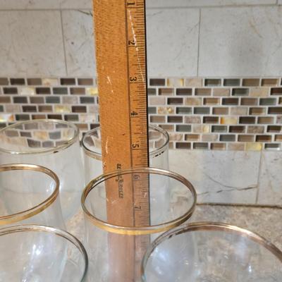 LOT 34K: Set of 12 Pasabahce Circle Art of Glass Gold Rim Glasses, Set of 7 Fostoria Classic Gold Water Goblets, and Set of 4 Artland...