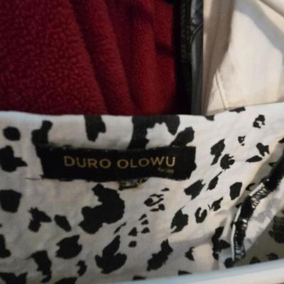 LOT 98Y: Women's Closet Contents With Multiple Items Such as Clothing, Shoes, Belts ; Photos Just Show a Small Sample of Contents